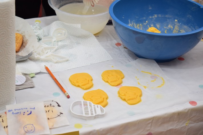 Skull-shaped biscuits ready for baking.